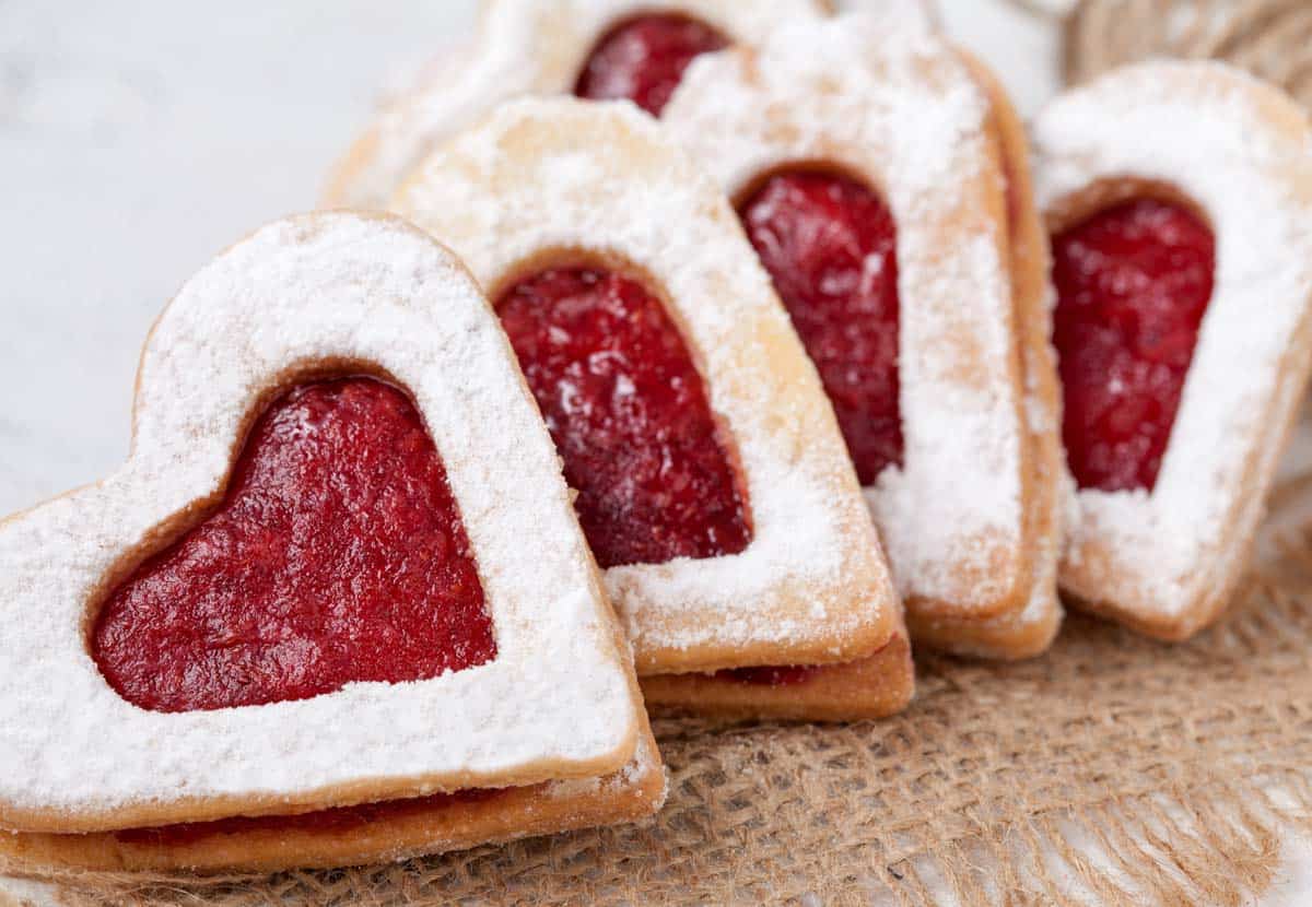 Heart-shaped Almond Cookies filled with Raspberry jam
