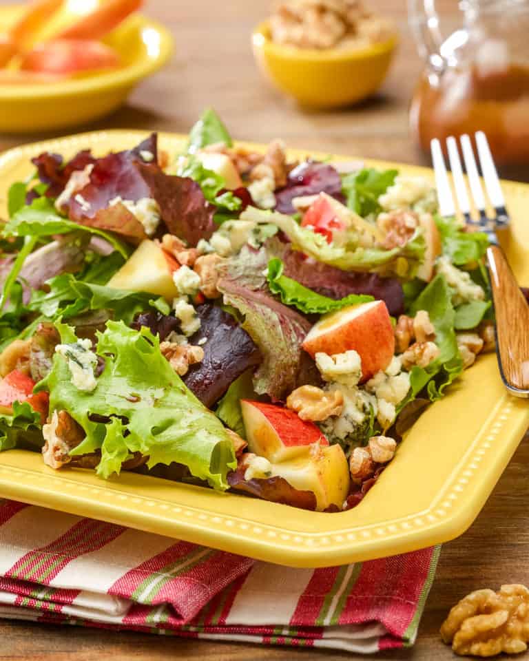 Square plate showing a generous portion of Apple Walnut Salad with Stilton Cheese