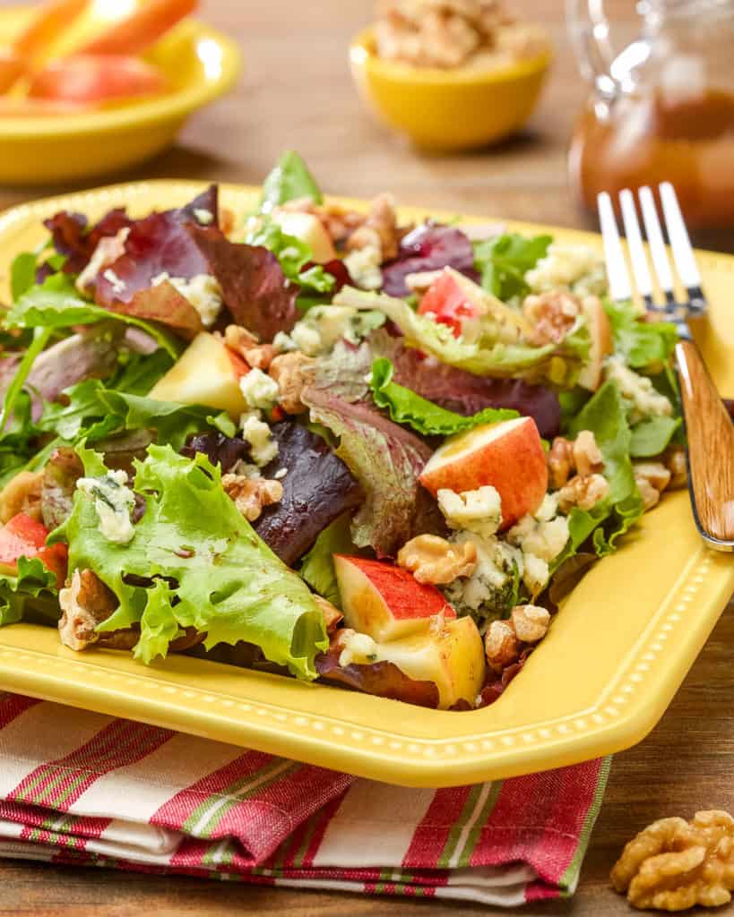 Square plate showing a generous portion of Apple Walnut Salad with Stilton Cheese