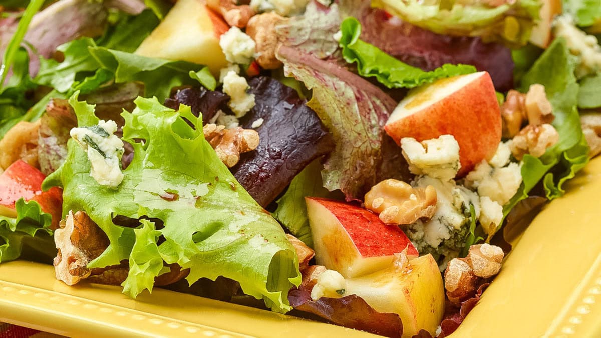 close up view of apple, walnut, and stilton salad