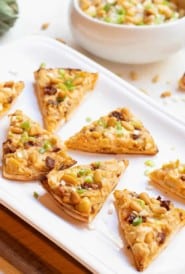 artichoke, sundried tomato and feta triangles on platter