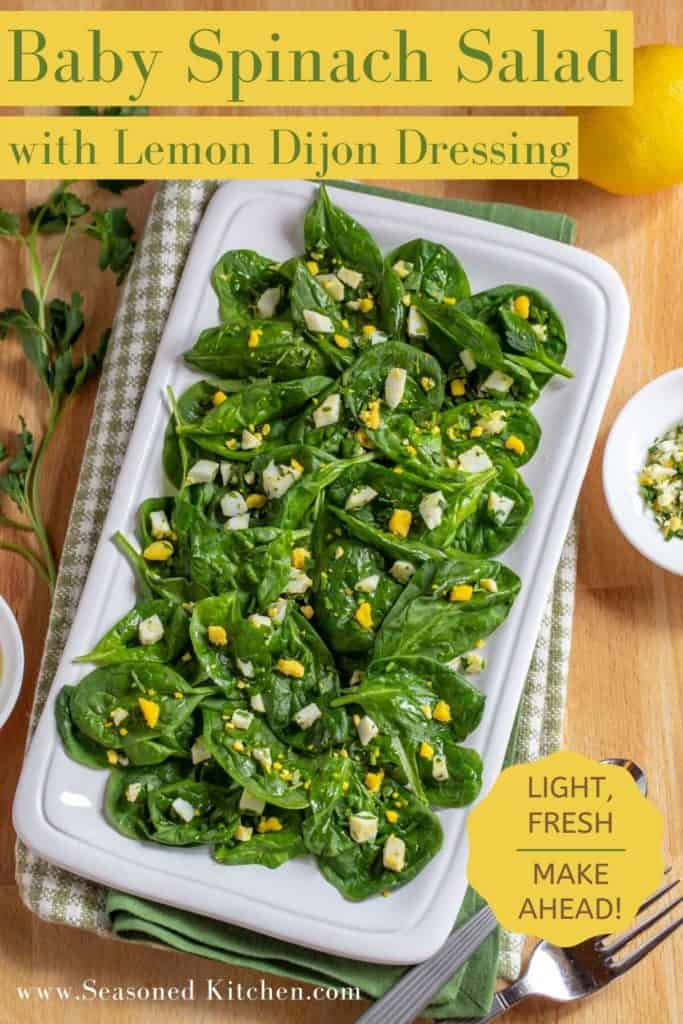 overhead shot of white platter holding Spinach Salad. Photo is formatted for sharing in social media
