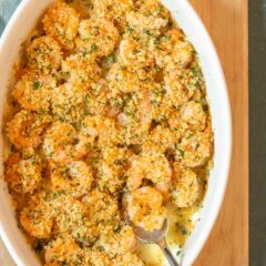 overhead shot of Baked Shrimp with a spoon holding one shrimp