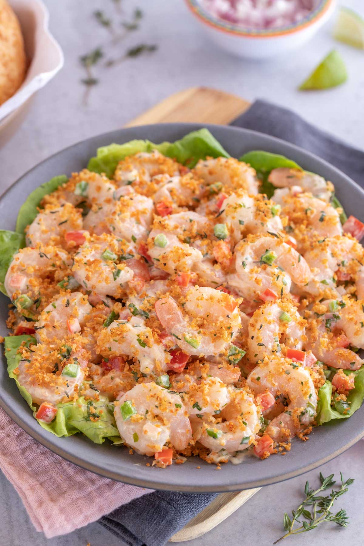 dark blue plate holding Shrimp Salad with Lime-Herb Dressing. 
