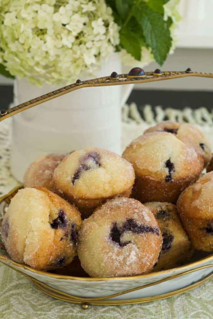 White and gold basket holding Blueberry Lemon Muffins
