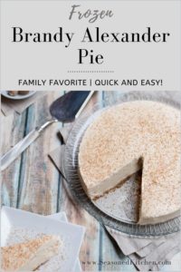 Frozen Brandy Alexander Pie on a glass plate, with a slice taken out. Slice is in bottom left of photo
