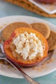 White plate holding one Butterscotch Pudding Filled Peach