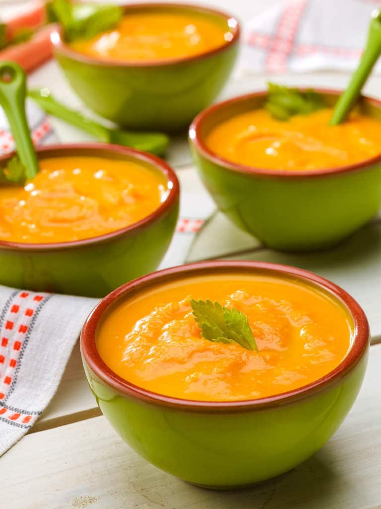 three bowls showing 3 servings of Creamy Carrot Ginger Soup