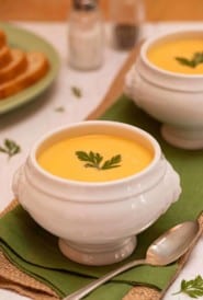 White footed soup bowl filled with Carrot Vichyssoise