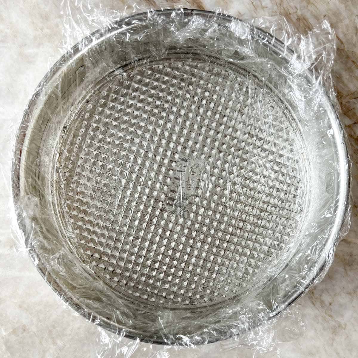 spring form pan lined with plastic wrap