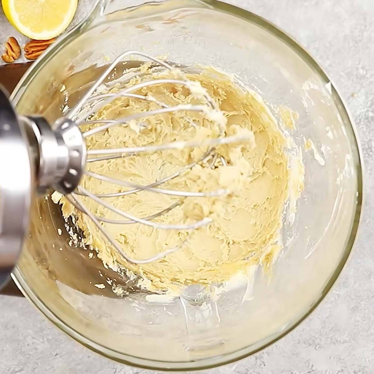 process shot showing creaming the butter and brown sugar together for the crust and topping