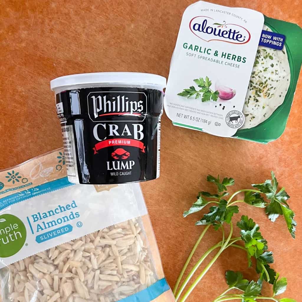 overhead view showing the 4 ingredients needed to make this crab dip