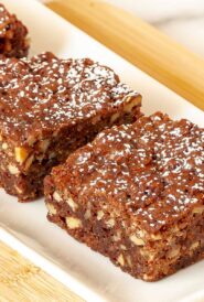 Close up of 2 Chewy Chocolate Brownies on a white platter