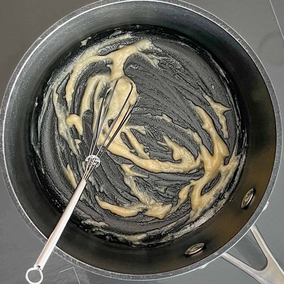 Whisking roux of butter and flour for base in Green Chile Sauce