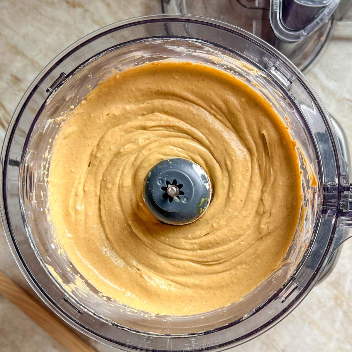 overhead view of Avocado Dressing in a food processor; shows how creamy the dressing should be