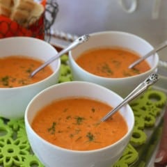 Individual white bowls of Chilled Tomato Dill Soup