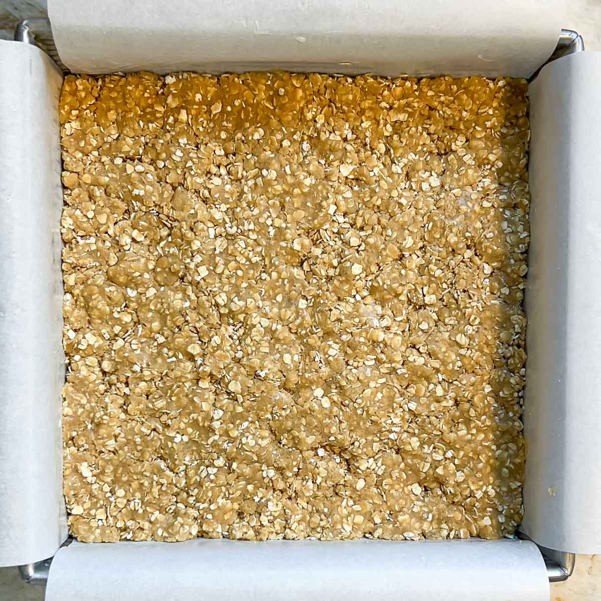 First (bottom) oat cookie layer in prepared pan