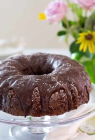 Triple Chocolate Zucchini Cake on glass cake platter