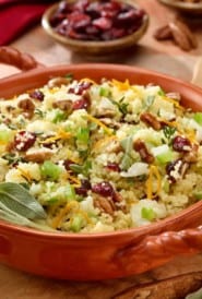 oval dish showing Couscous with cranberries and pecans