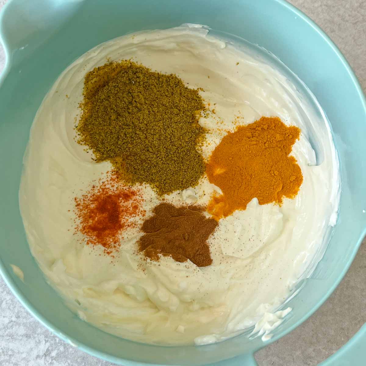 Adding curry dressing spices to mayo-cream-yogurt base