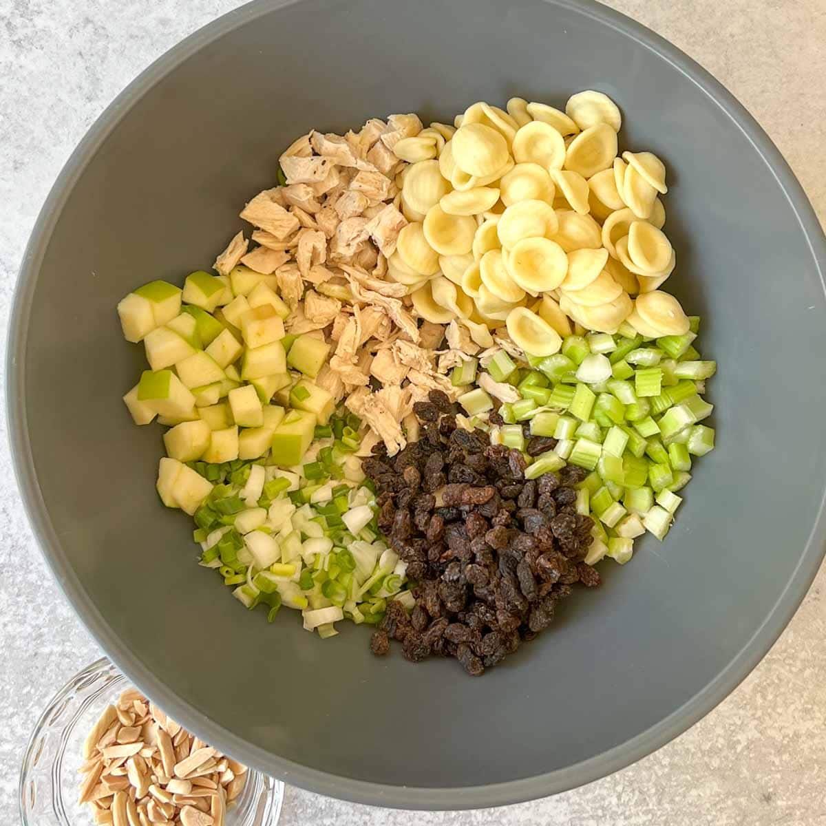 Curry Chicken Salad with Pasta ingredients in a large bowl