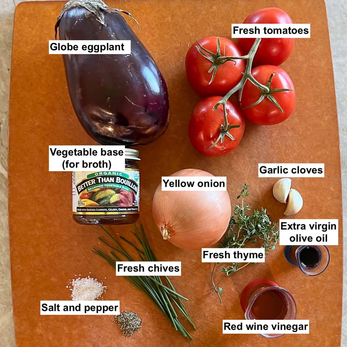 cutting board holding all the ingredients for Roasted Eggplant Soup, with labels