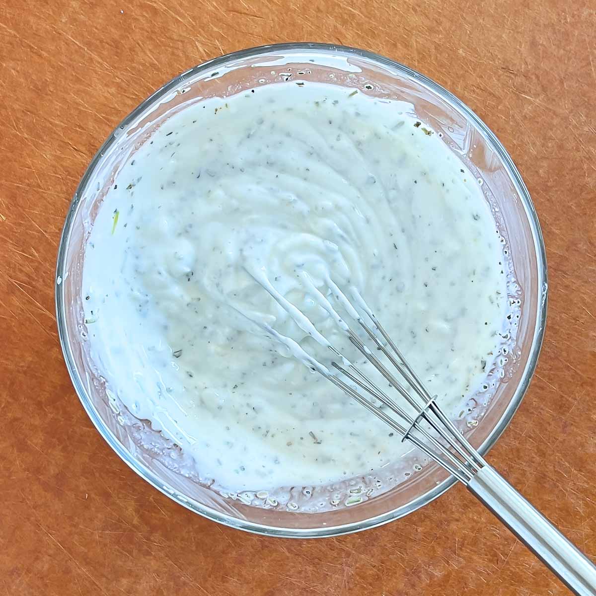 showing mixing the yogurt marinade ingredients