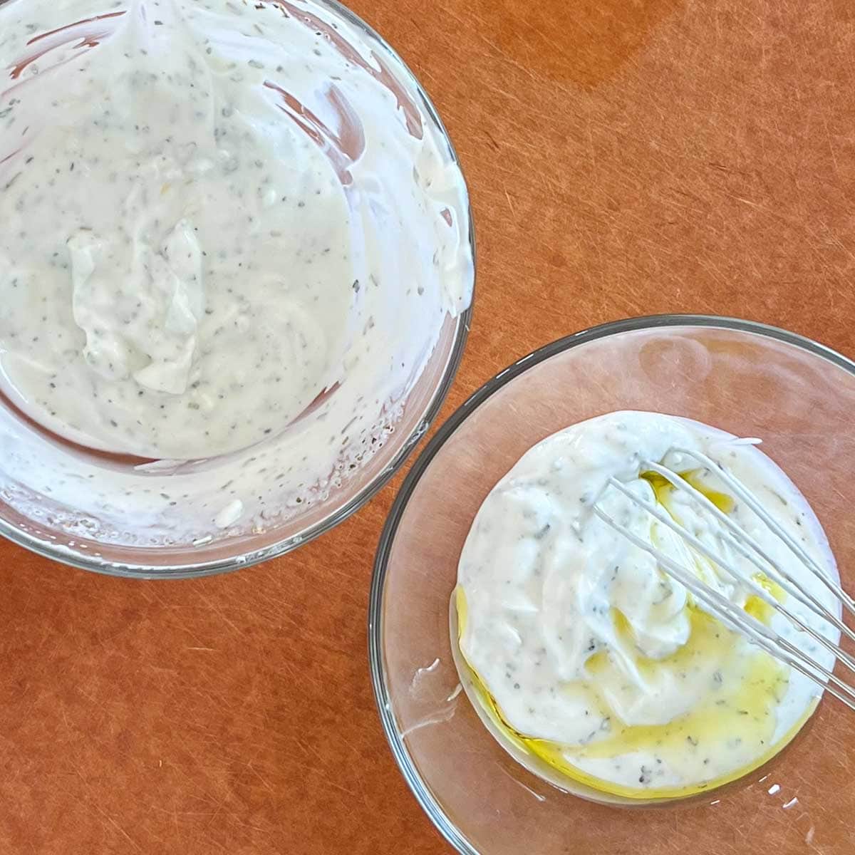 Showing the yogurt marinade divided between two bowls, with olive oil added to one