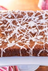 Light blue cake stand holding a Sticky Ginger Cake