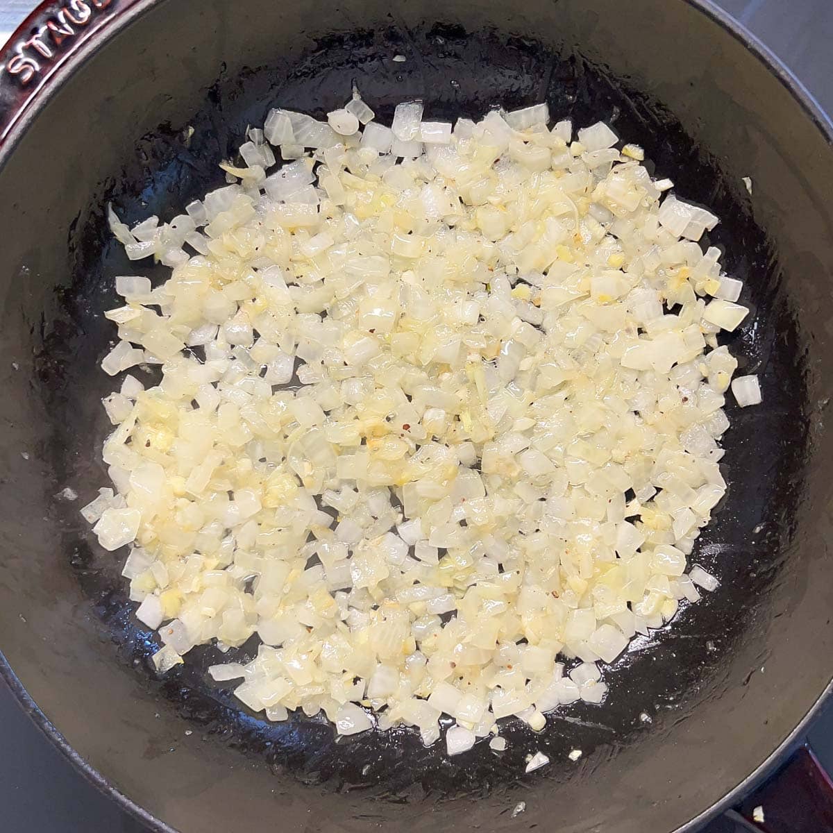 Process shot - onions and garlic cooking for white sauce