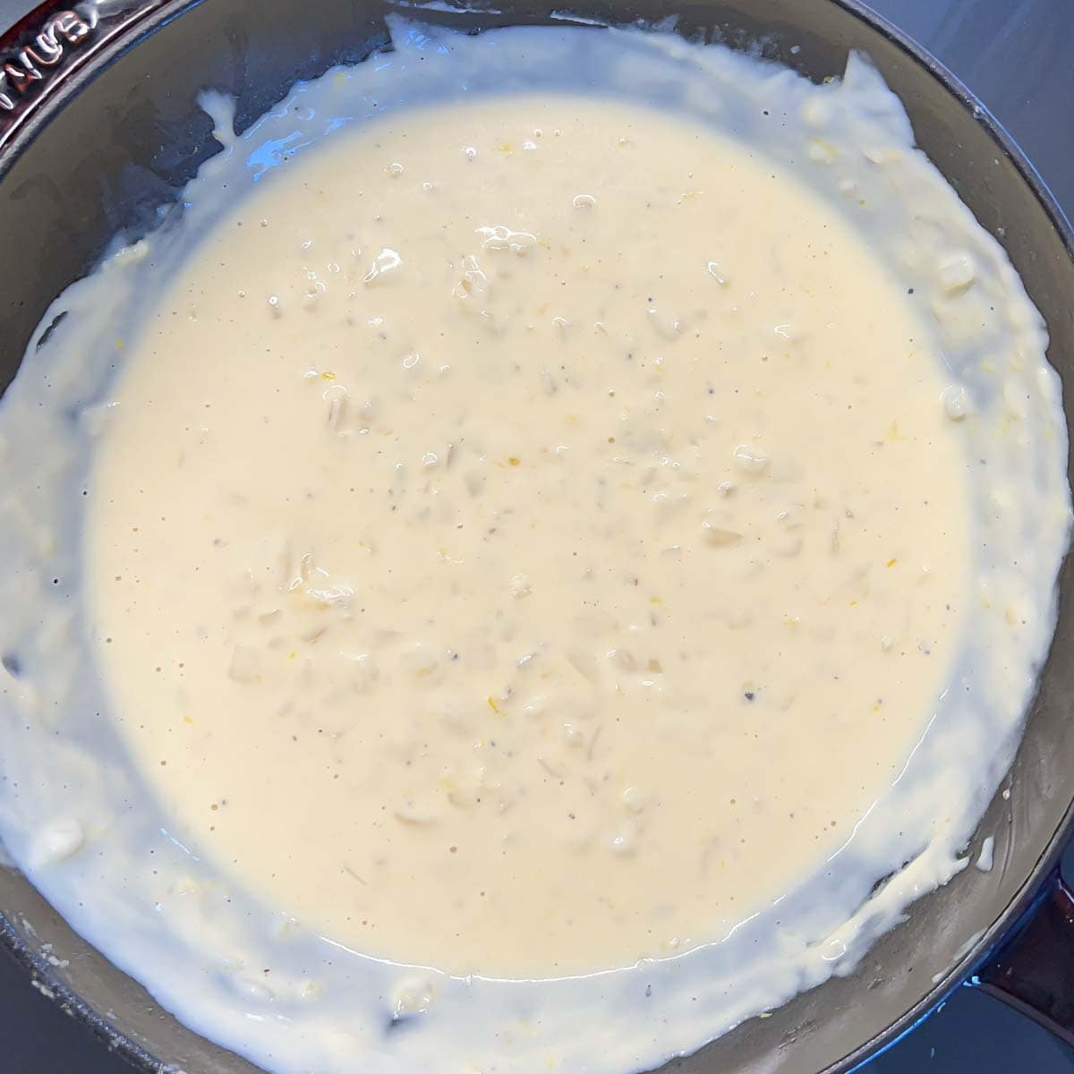 process shot - white sauce with onions cooking to thicken