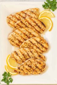 overhead shot of Lemon Pepper Grilled Chicken on a white platter