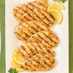 overhead shot of Lemon Pepper Grilled Chicken on a white platter