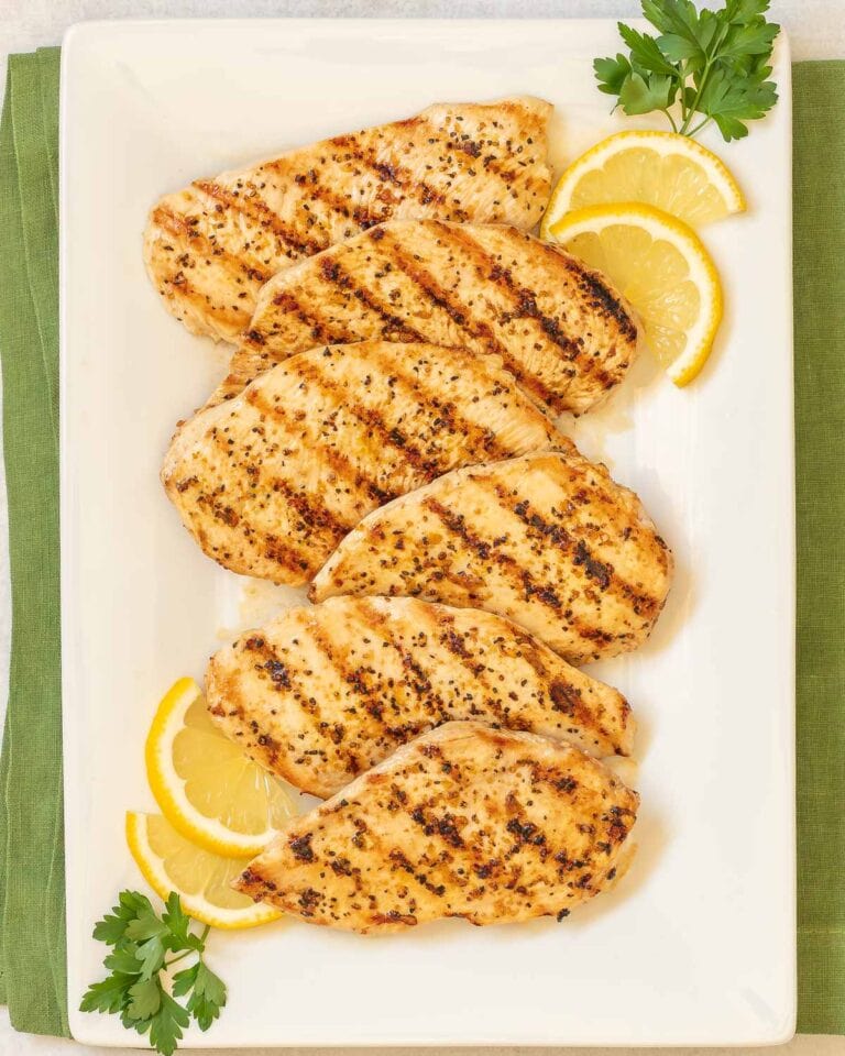 overhead shot of Lemon Pepper Grilled Chicken on a white platter