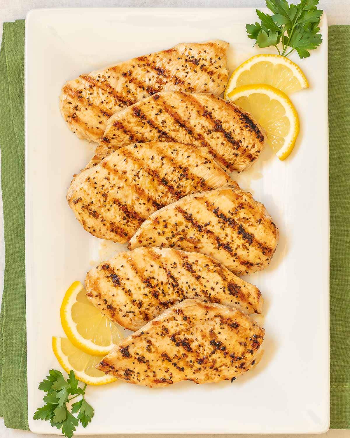 overhead shot of Lemon Pepper Grilled Chicken on a white platter