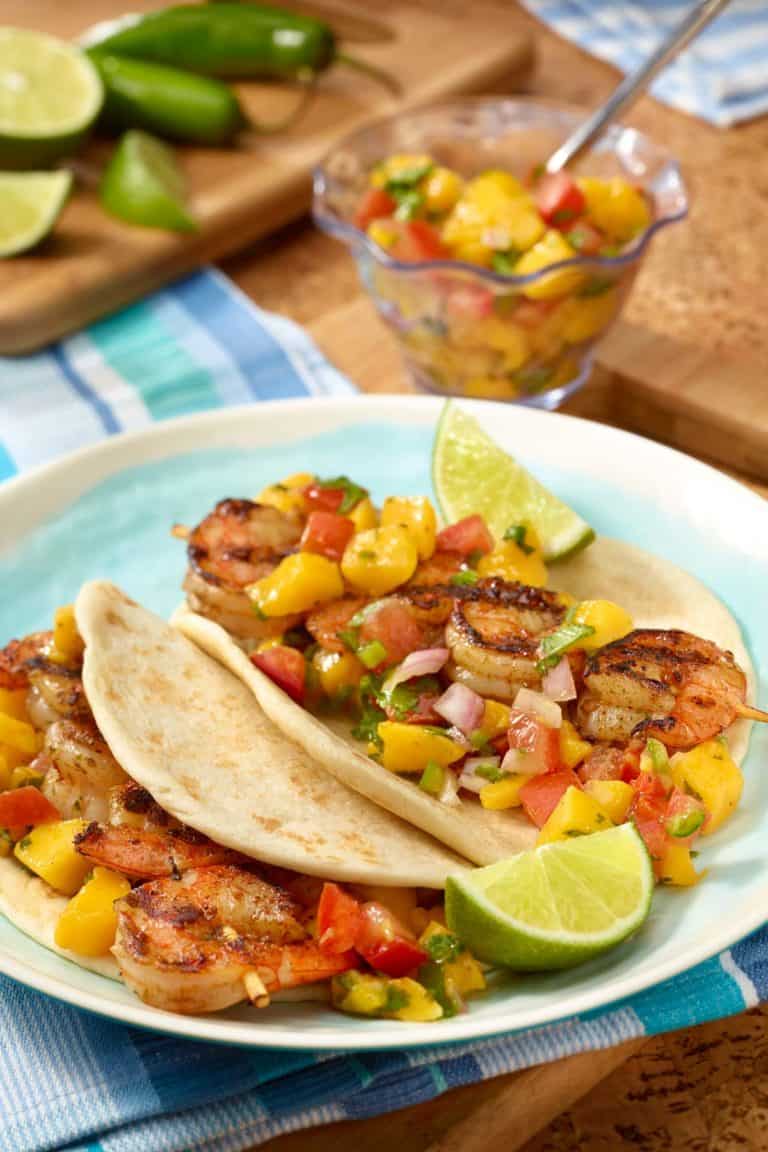 Plate with two Grilled Shrimp Tacos with Tomato-Mango Salsa