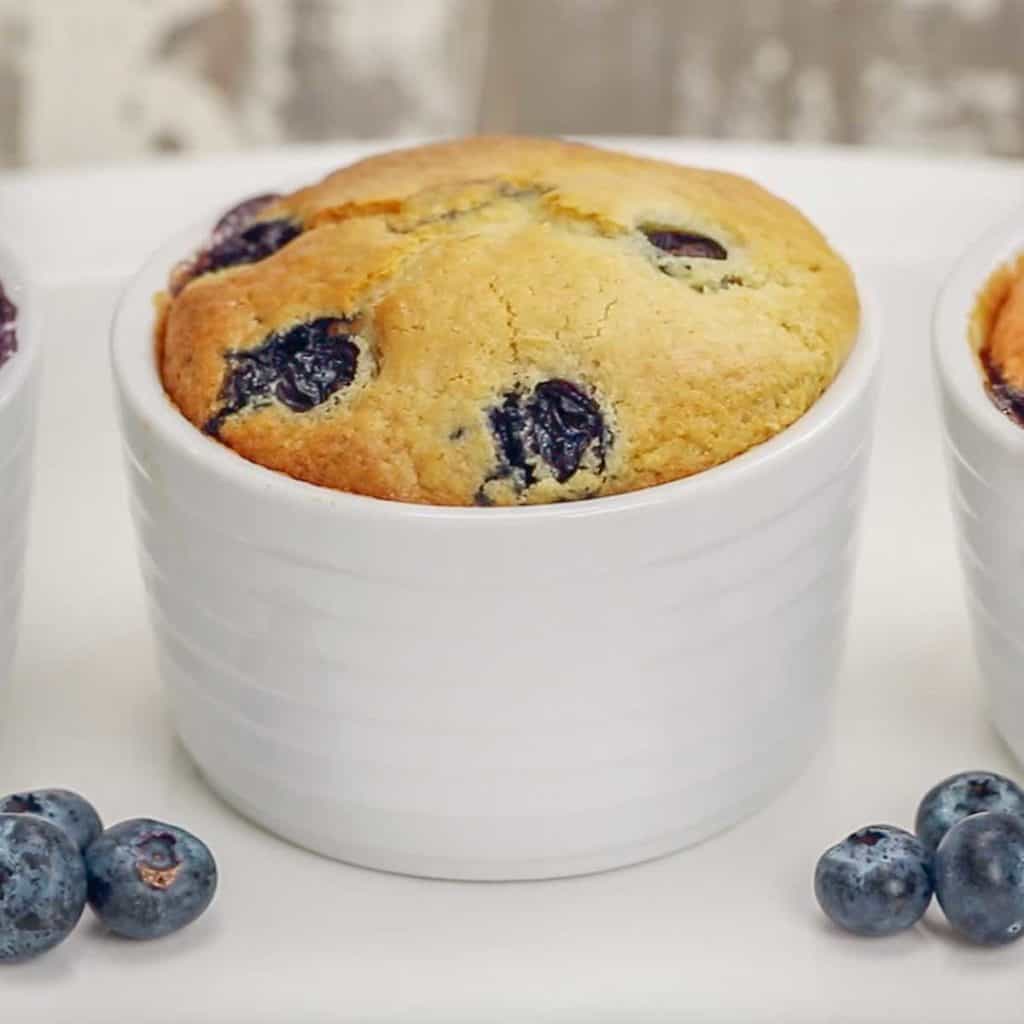 white ramekin filled with Individual Blueberry Cake