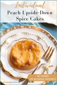 white dessert plate with an Individual Peach Upside Down Cake. Blue napkin iin background