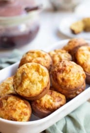 White ceramiv bowl filled with Italian Popovers
