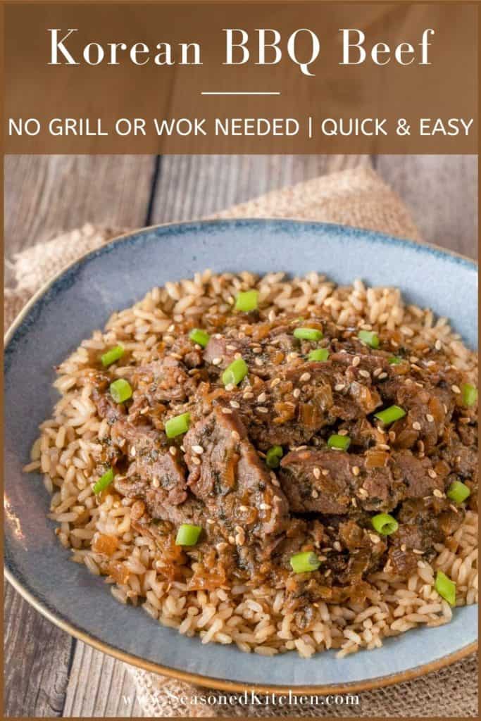 Blue plate holding Korean BBQ Beef over brown rice. Plate is sitting on a napkin