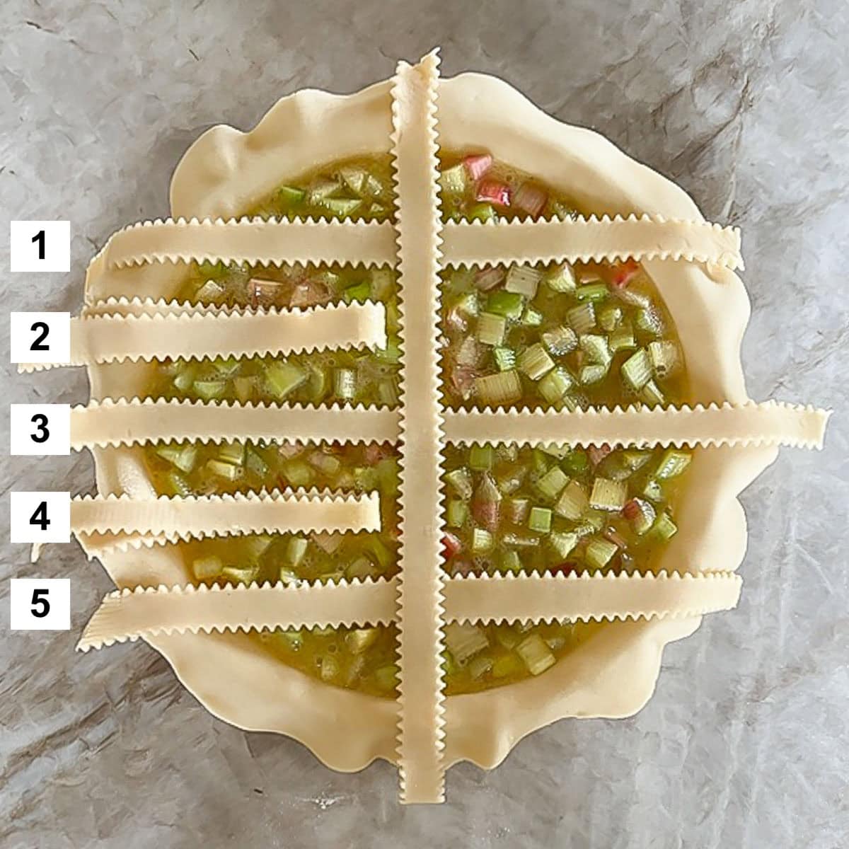 Filled pie with partially woven strips on top, showing step 1 of the weaving process