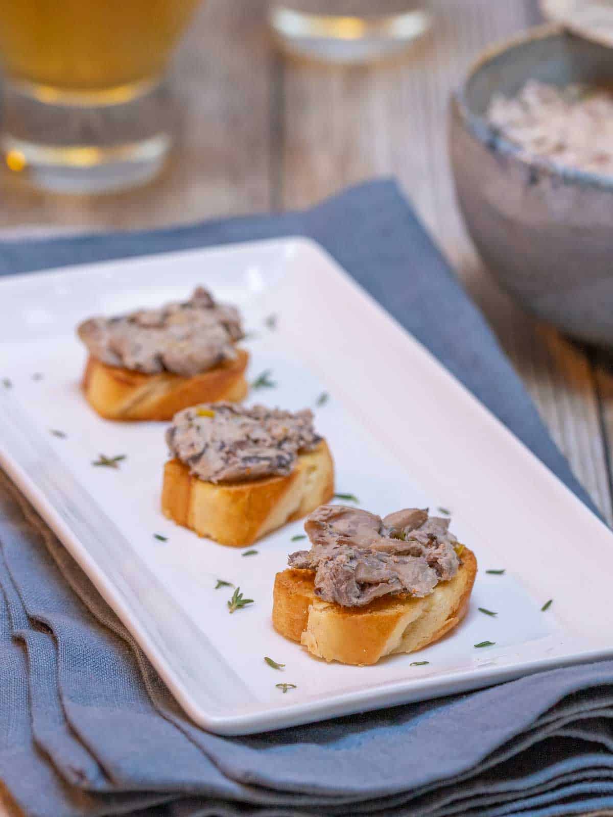 white serving platter showing three servings of Mushroom Pâté