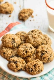 Mini Oatmeal Raisin Cookies on small plate with glass of milk