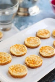 Onion Parmesan Toasts on white platter