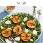 White round shallow bowl filled with Grilled Peach and Fresh Mozzarella Cheese Salad