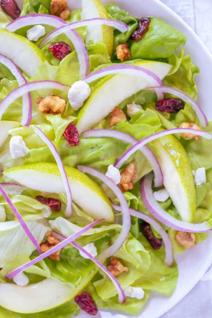 Close up of Pear and Goat Cheese Salad, showing detail on ingredients