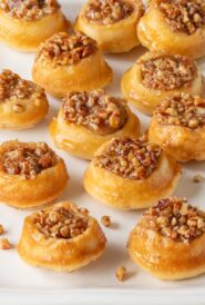 white platter holding around 1 dozen mini pecan rolls