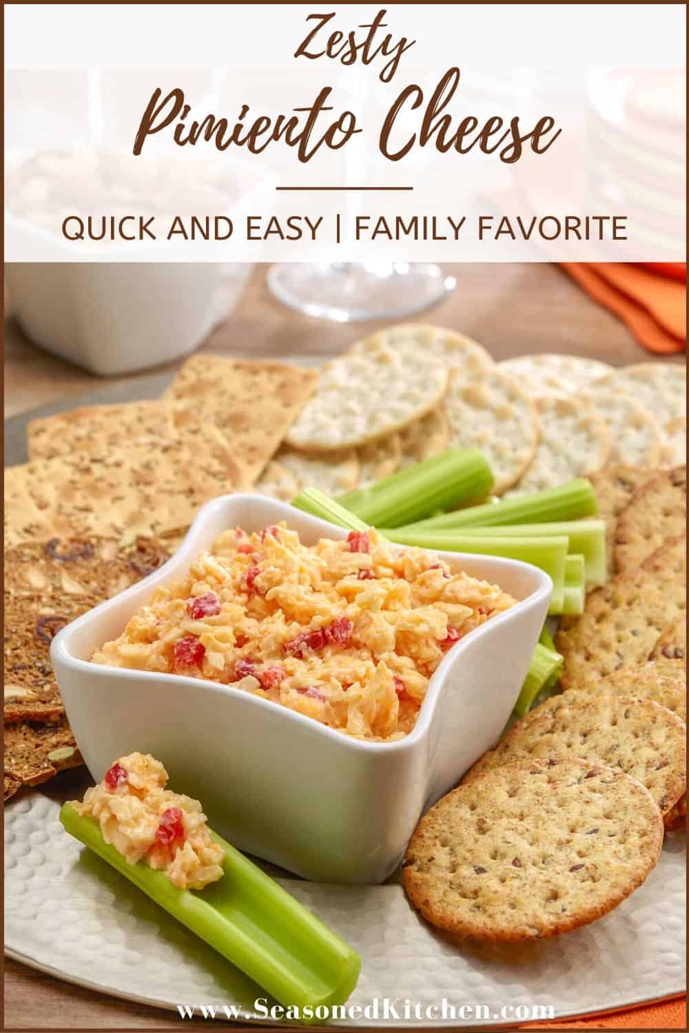 small white dish holding pimento cheese spread, with a celery stick holding one portion