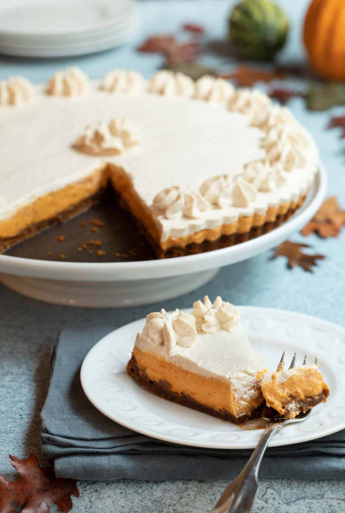 Rum Pumpkin Tart with a slice on a plate in front