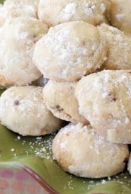 green ruffled plate filled with Grandma Clayton's Sand Tarts